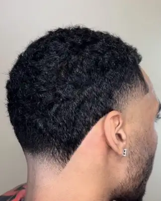Taper fade with a sharp line-up, cut at Studio K