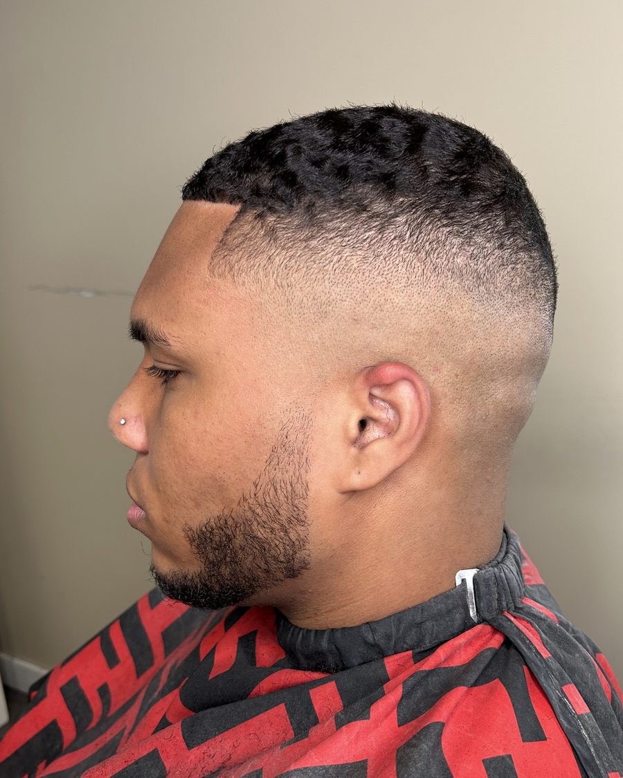Burst fade with waves and a shaped beard, cut at Studio K