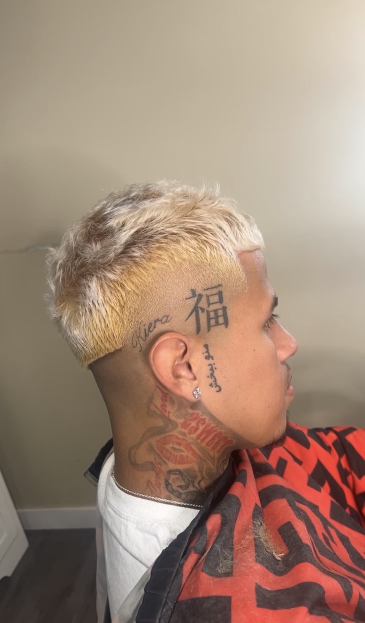 Blond textured crop with closely faded sides, cut at Studio K